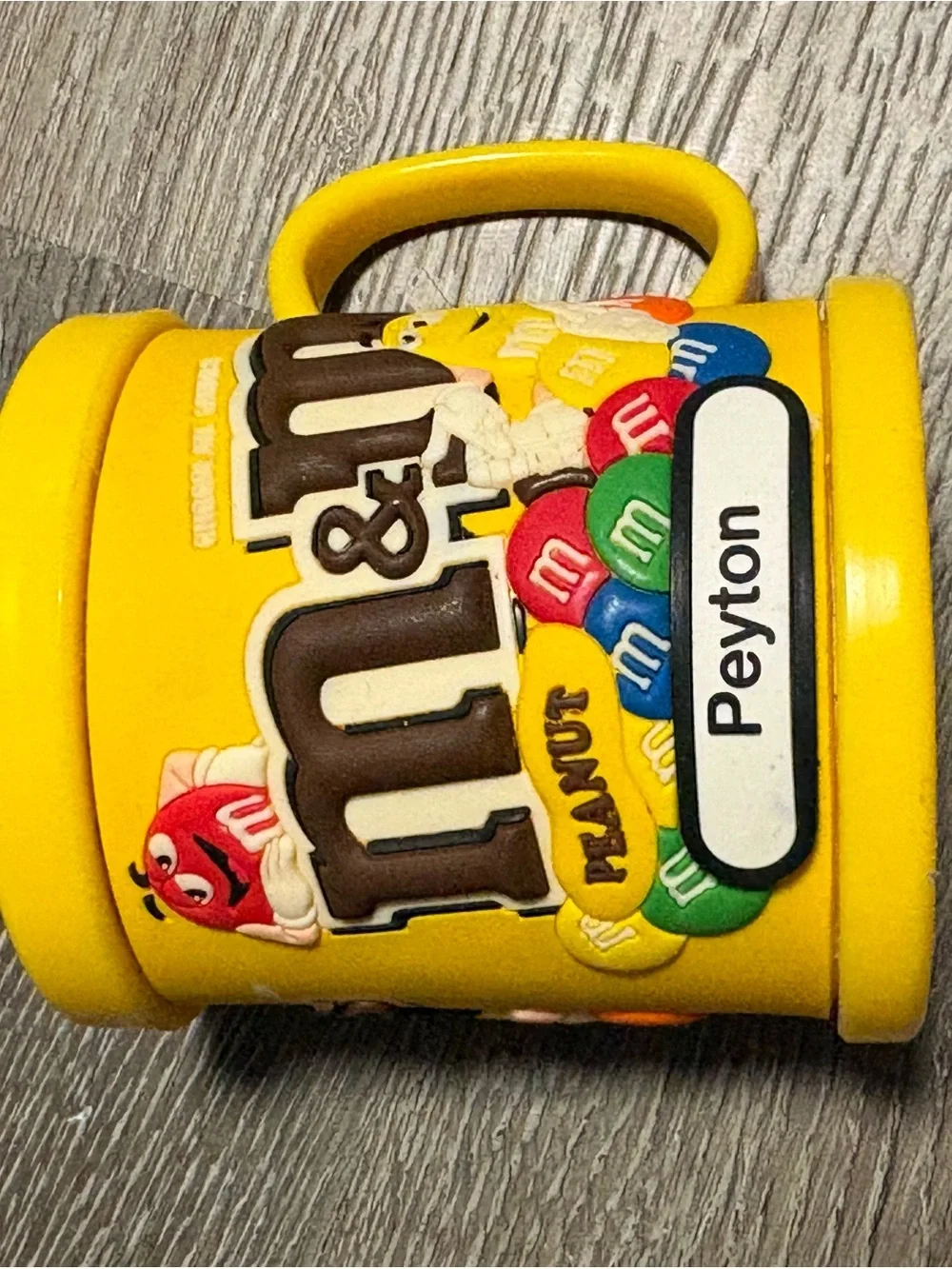 M&M'S Yellow Kids Mug with Multicolor Candy Graphics with name Peyton